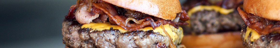 Eating American (Traditional) Burger at BurgerBurger restaurant in Fredericksburg, TX.